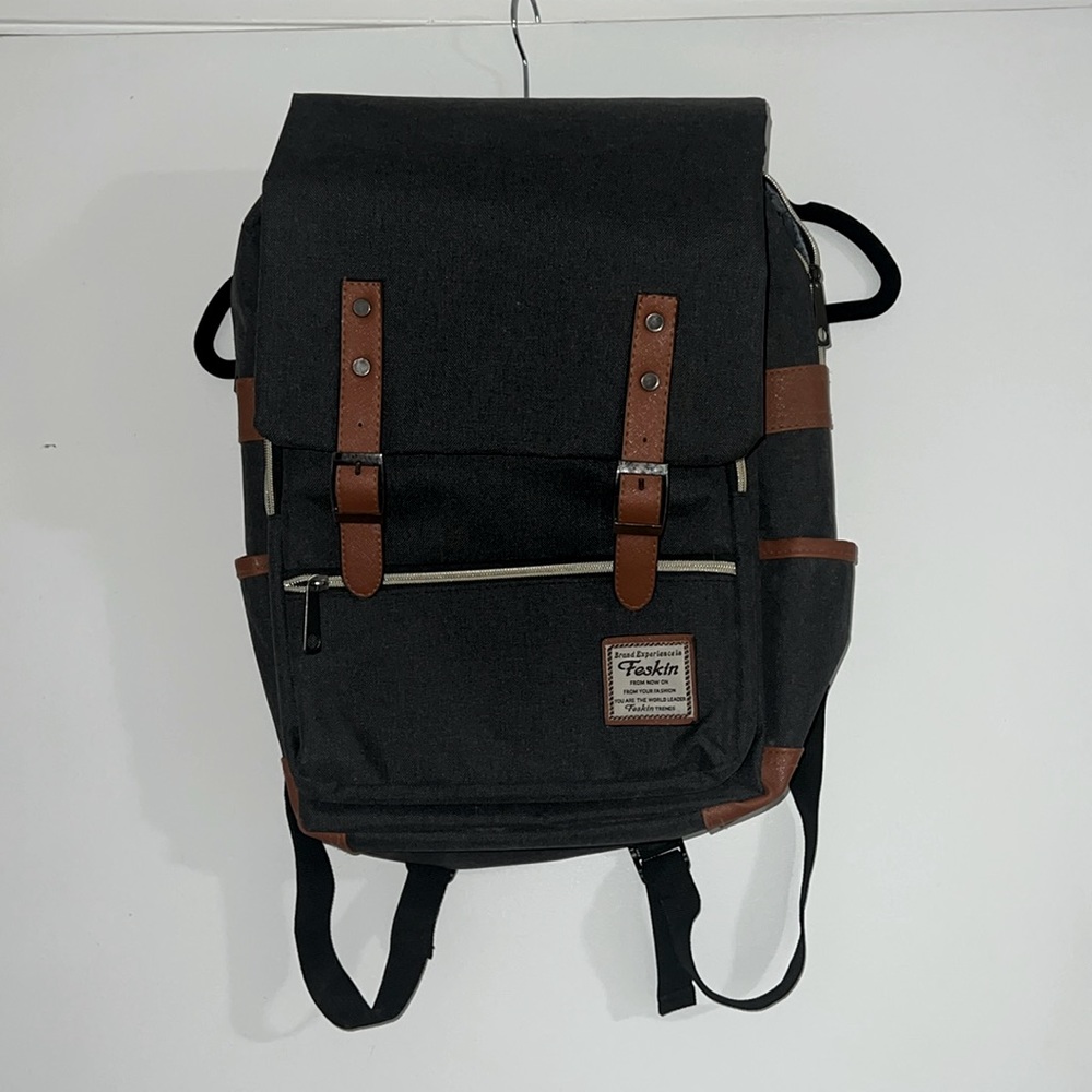 Grey and brown accented backpack with laptop sleeve!